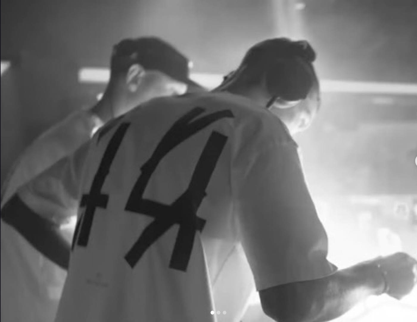 Pluto seen from behind, number 14 on his shirt